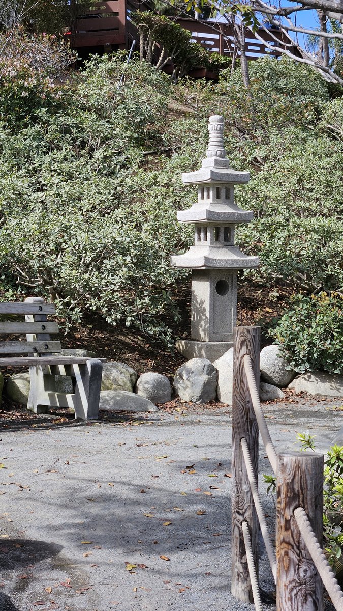 Stone lantern and weathered wooden fence in the Japanese Friendship Garden, Balboa Park
