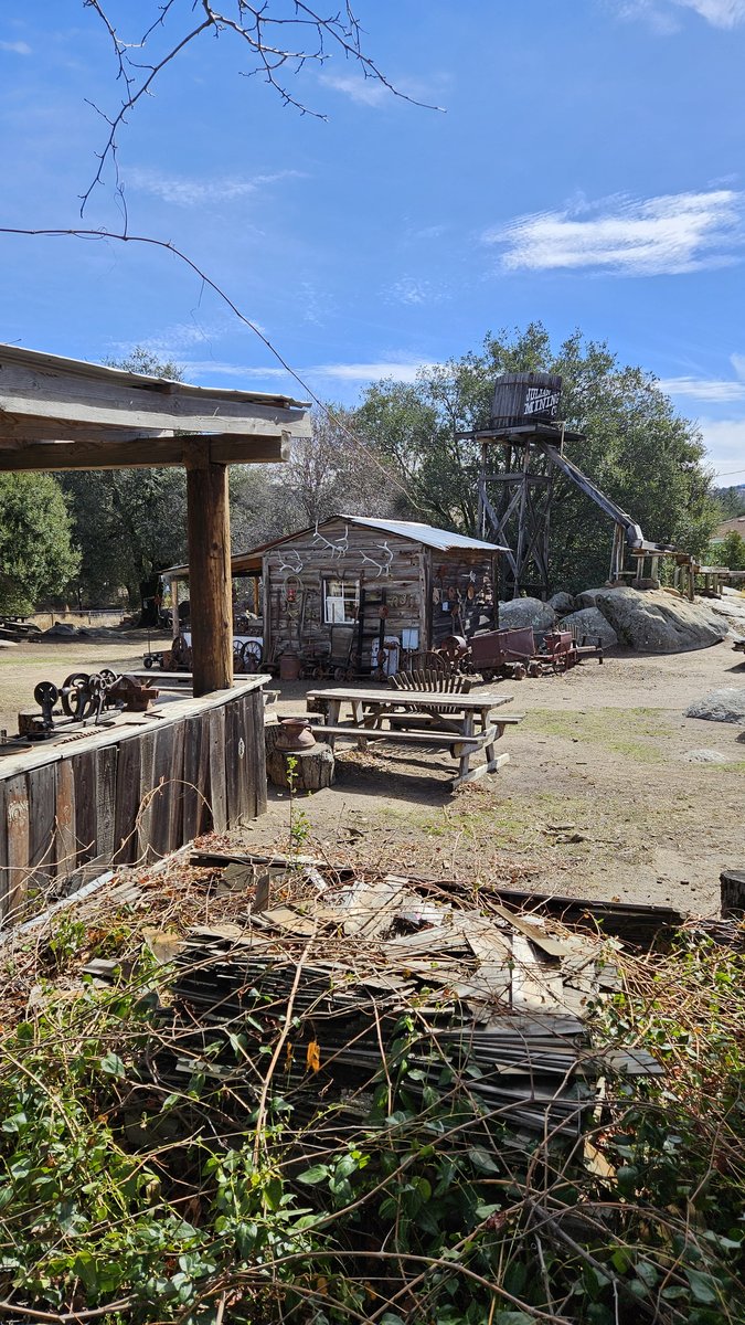 Wooden walkway and stairs descending into the rocky entrance of the Eagle and High Peak Mine in Julian, California