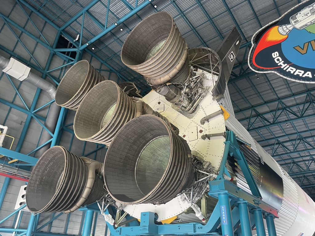 Close-up of the five massive F-1 engine nozzles at the base of the Saturn V rocket on display at Kennedy Space Center