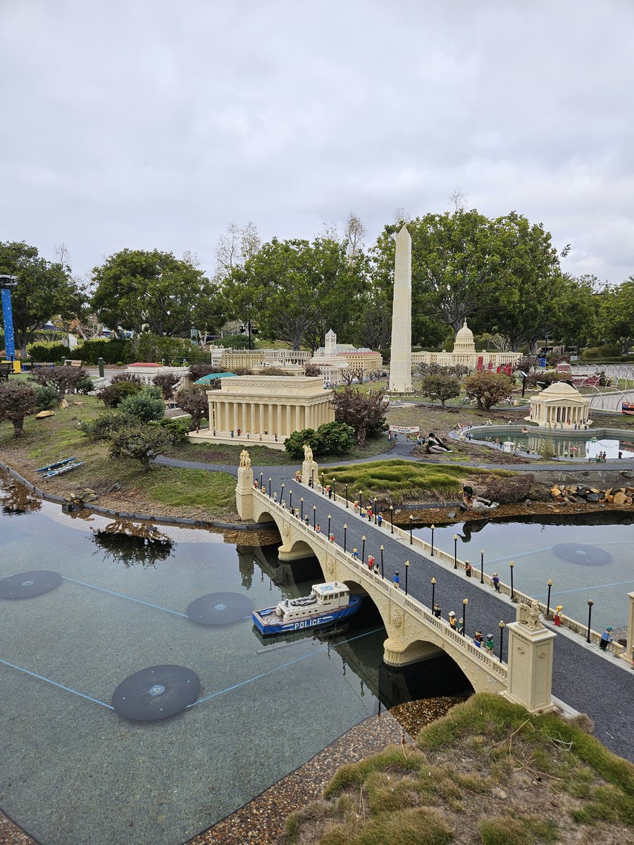 Aerial view of Miniland USA at Legoland California, showing the LEGO city layout with a bridge and buildings stretching into the distance