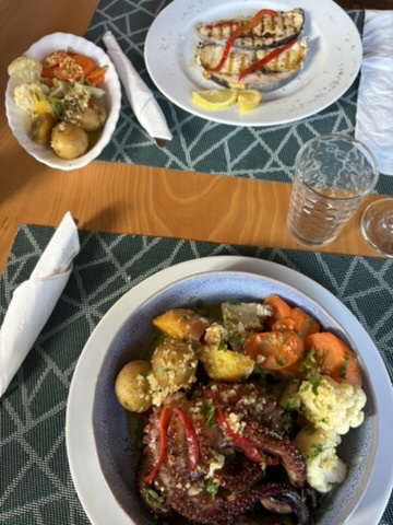Grilled octopus served with potatoes and cauliflower at a restaurant in the Azores
