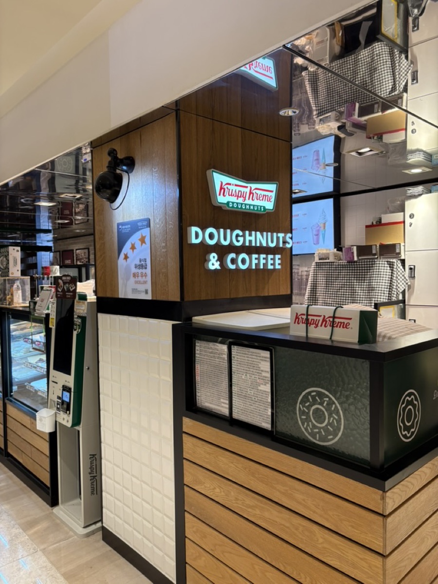 A Krispy Kreme Doughnuts & Coffee counter inside a Korean shopping centre